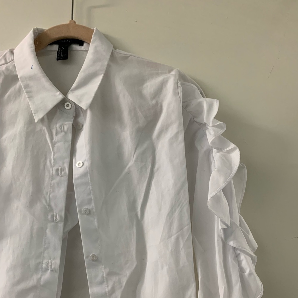 White ruffled button down corset shirt.